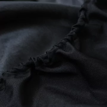 EcoSmart All-Season Cover detail in black Oxford polyester fabric shows durable accessory protection for outdoor fireplace living and landscaping.