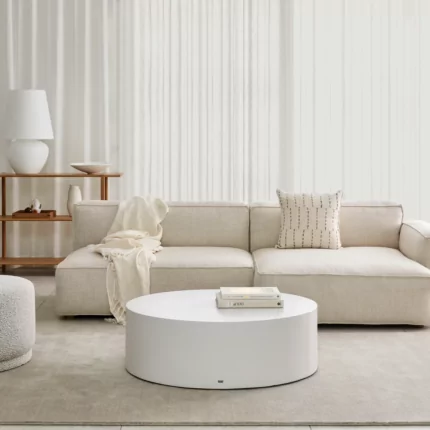 Blinde Design Circ 40 concrete coffee table anchors a private living room, offering a sleek round centrepiece for contemporary interior style.